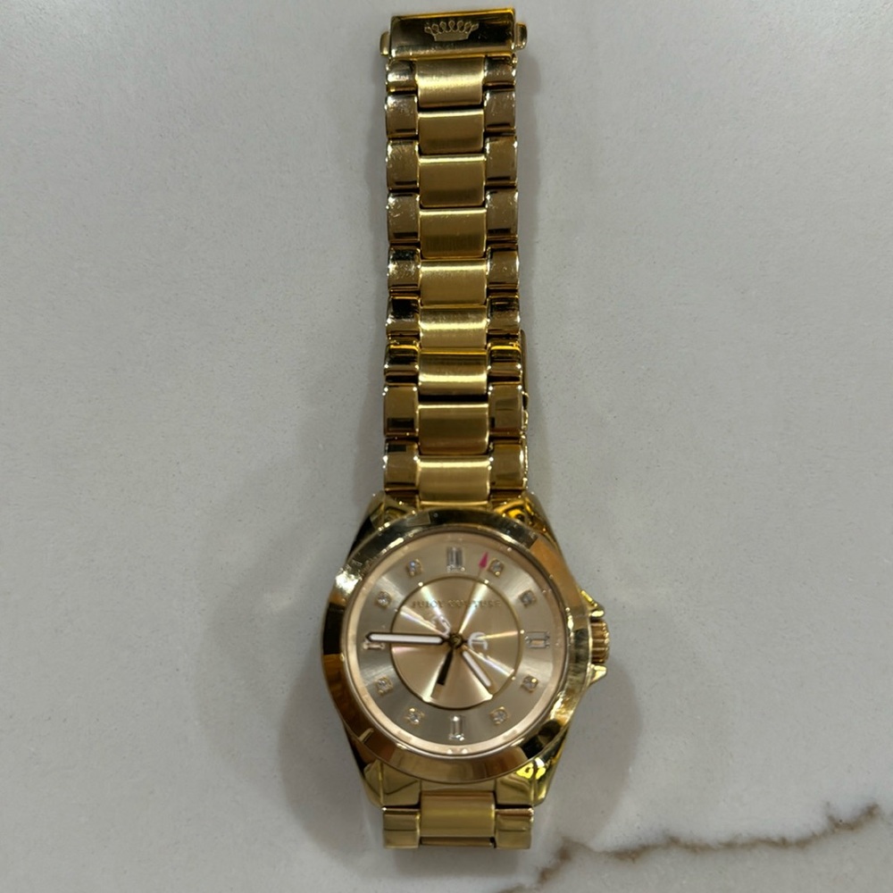 Juicy Couture gold watch.